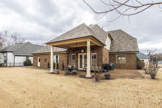 190 Links View Dr, Oakland, TN 38060 - back of property featuring french doors, brick siding, a patio area, and roof with shingles