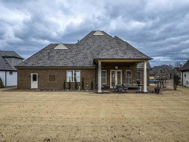 190 Links View Dr, Oakland, TN 38060 - rear view of property with brick siding, a lawn, an outdoor hangout area, french doors, and a patio