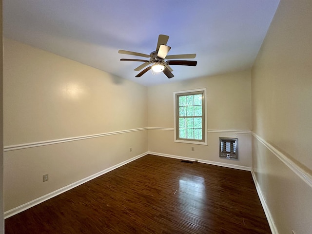 1790 Country Club Rd, Somerville, TN 38068 - empty room with dark wood-style flooring, a ceiling fan, and heating unit