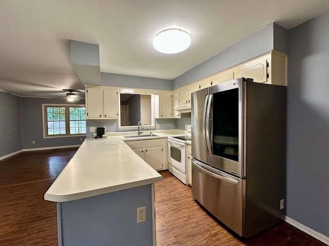 1790 Country Club Rd, Somerville, TN 38068 - kitchen with smart refrigerator, white electric stove, dark wood-style flooring, and light countertops