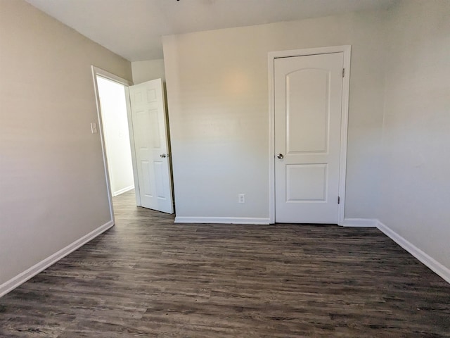 4499 Range Line Rd, Memphis, TN 38127 - unfurnished bedroom with dark wood finished floors and baseboards