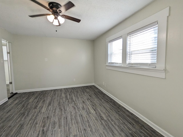 4499 Range Line Rd, Memphis, TN 38127 - empty room featuring dark wood finished floors, a ceiling fan, and a textured ceiling