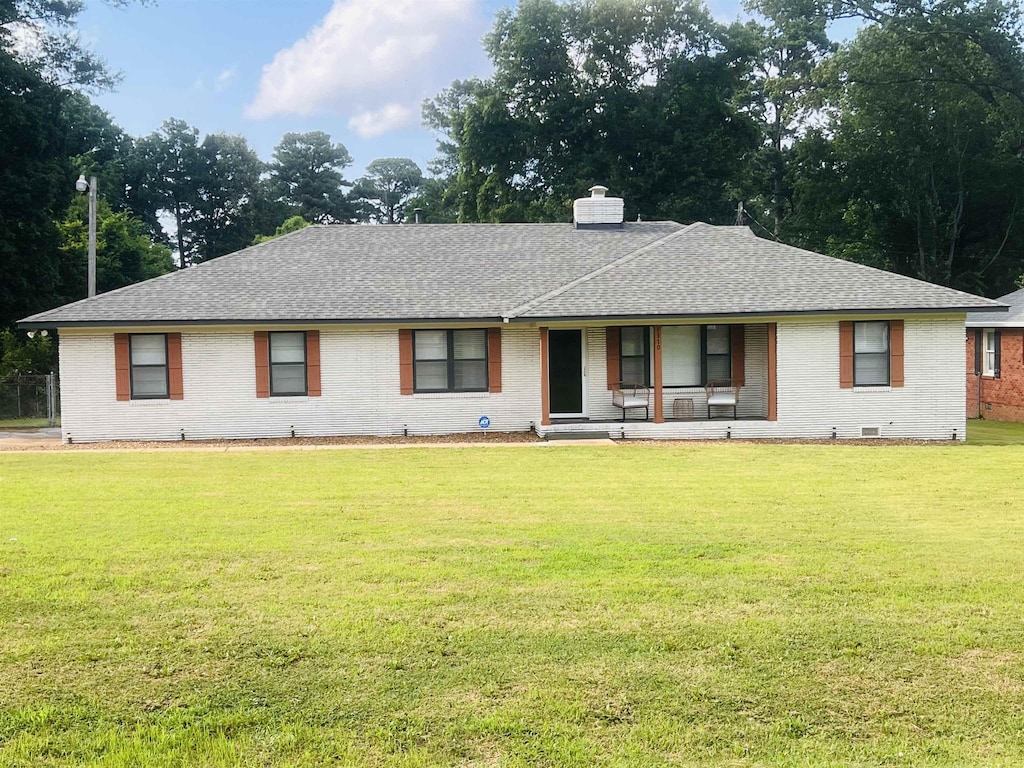 1370 Oakwood Dr, Memphis, TN 38116 - single story home with covered porch, brick siding, a front lawn, roof with shingles, and a chimney
