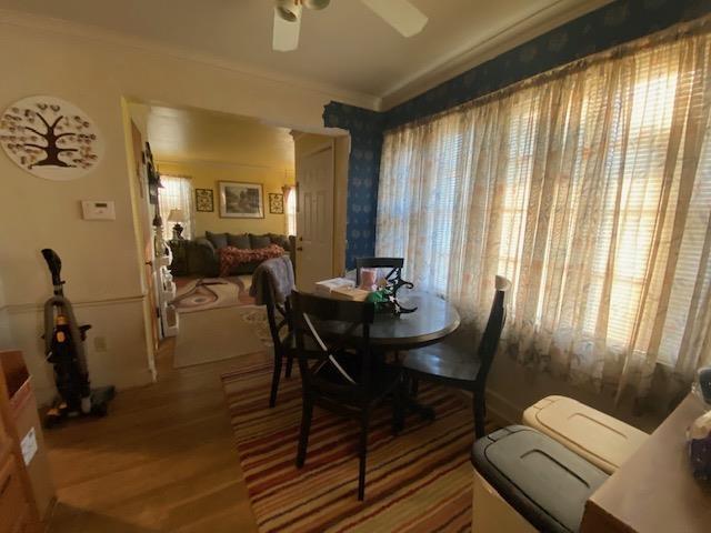 4643 E Renshaw Dr, Memphis, TN 38122 - dining area featuring ornamental molding, a ceiling fan, and wood finished floors