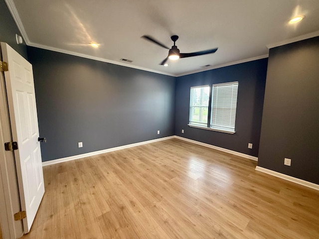 32 Foxchase Dr, Mason, TN 38049 - spare room featuring ornamental molding, a ceiling fan, and light wood-type flooring