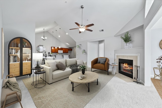 8897 Parkview Oaks Cir, Olive Branch, MS 38654 - living room featuring light carpet, high vaulted ceiling, a tile fireplace, and a ceiling fan