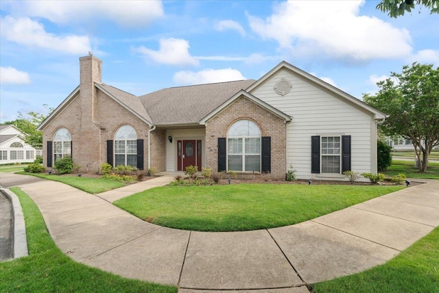 8897 Parkview Oaks Cir, Olive Branch, MS 38654 - single story home featuring brick siding, a front lawn, and a chimney