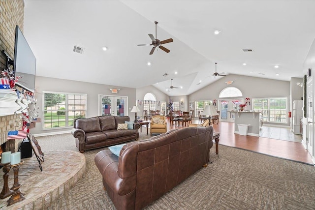 8897 Parkview Oaks Cir, Olive Branch, MS 38654 - living area featuring ceiling fan, lofted ceiling, a lit fireplace, carpet flooring, and recessed lighting