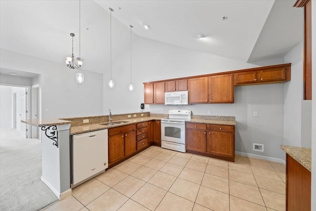 8897 Parkview Oaks Cir, Olive Branch, MS 38654 - kitchen with white appliances, brown cabinetry, a peninsula, decorative light fixtures, and high vaulted ceiling
