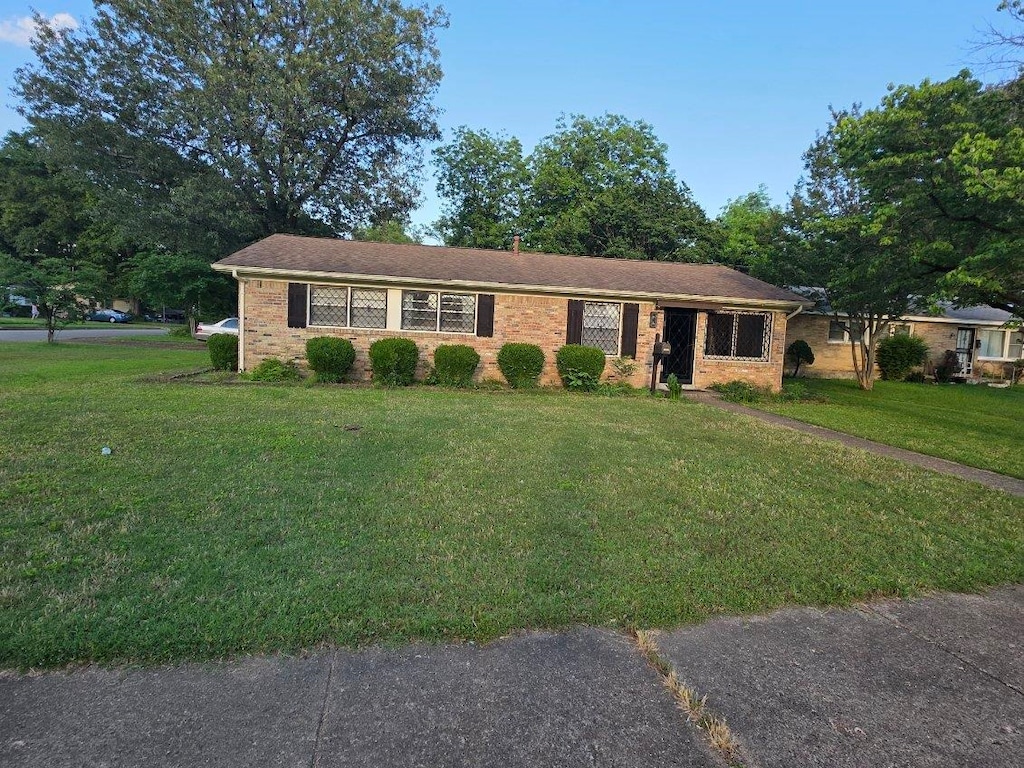 850 Angelina Pl, Memphis, TN 38122 - ranch-style home featuring a front lawn and brick siding