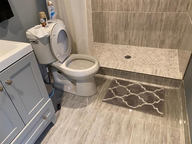 7148 Tranquil Creek Dr, Memphis, TN 38125 - bathroom with a stall shower, vanity, and wood finished floors