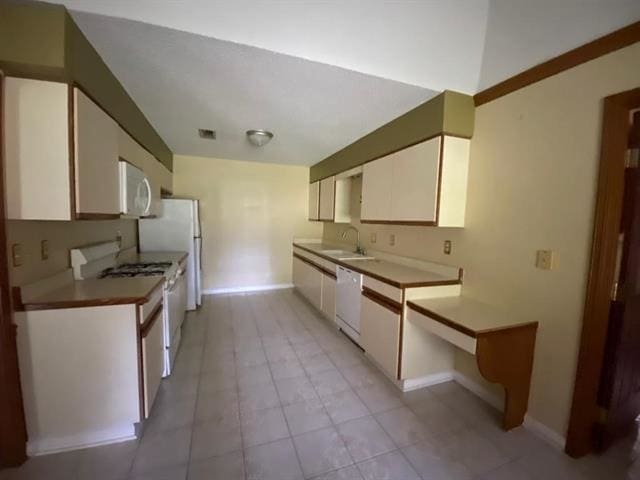 7148 Tranquil Creek Dr, Memphis, TN 38125 - kitchen featuring white appliances, white cabinetry, and light tile patterned floors