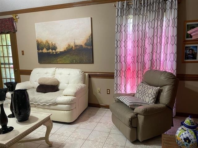 7148 Tranquil Creek Dr, Memphis, TN 38125 - living room with ornamental molding and light tile patterned floors