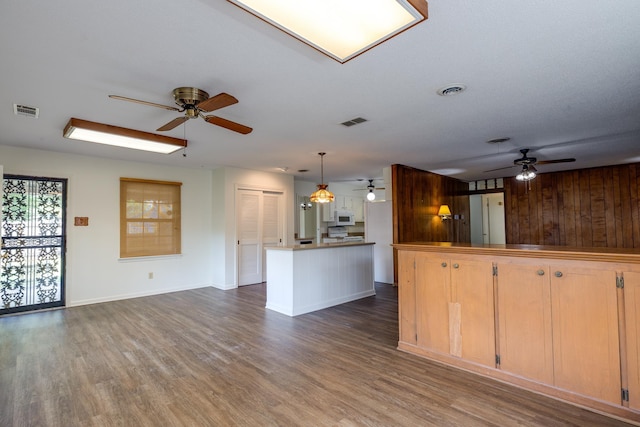 5662 Chapman Ave, Memphis, TN 38119 - kitchen with a ceiling fan, white microwave, open floor plan, and dark wood finished floors