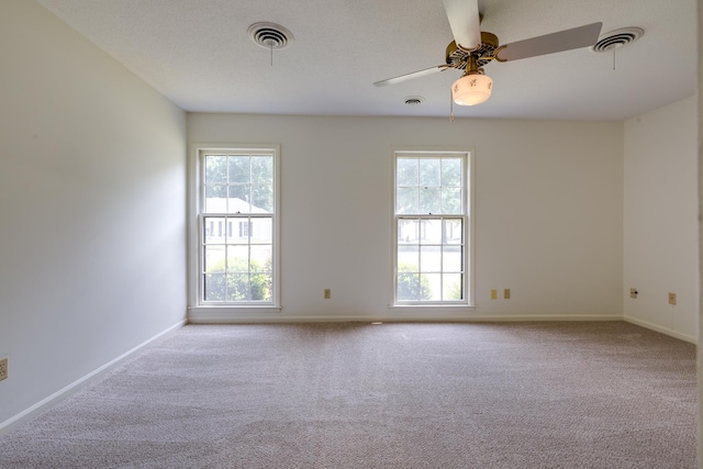 5662 Chapman Ave, Memphis, TN 38119 - carpeted empty room featuring plenty of natural light and a ceiling fan