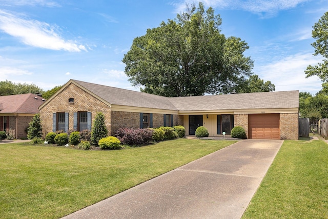 5662 Chapman Ave, Memphis, TN 38119 - single story home with brick siding, an attached garage, and concrete driveway