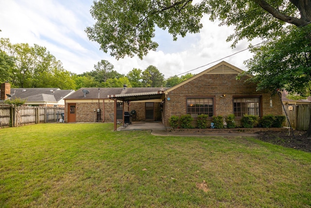 5662 Chapman Ave, Memphis, TN 38119 - rear view of house featuring brick siding, a patio, and a fenced backyard