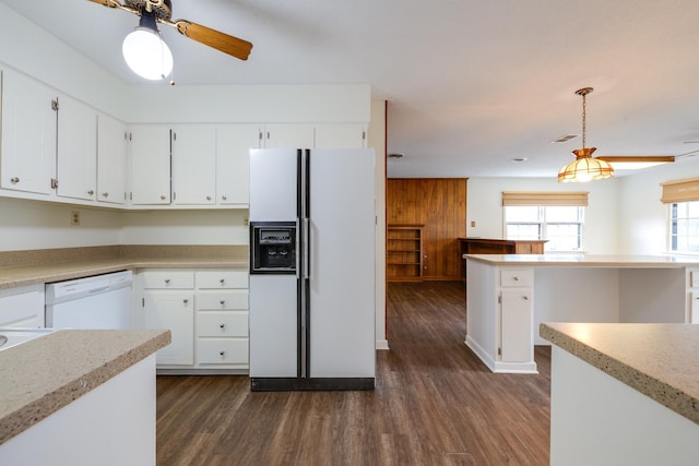5662 Chapman Ave, Memphis, TN 38119 - kitchen with white appliances, dark wood-type flooring, light countertops, and white cabinetry