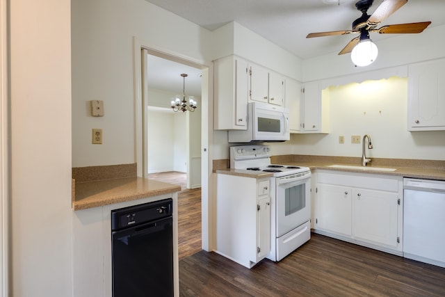 5662 Chapman Ave, Memphis, TN 38119 - kitchen with white appliances, dark wood-style flooring, a ceiling fan, white cabinetry, and a chandelier