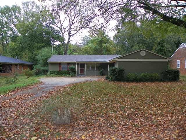 3074 Overbrook Rd, Memphis, TN 38128 - single story home with driveway and view of wooded area