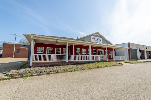 119 N 4th St, Selmer, TN 38375 - view of front facade with covered porch