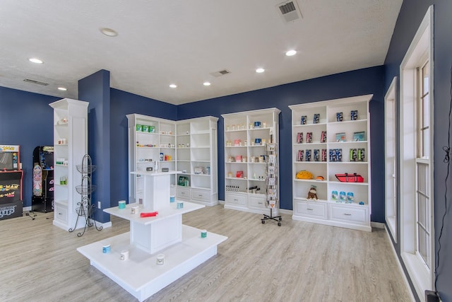 119 N 4th St, Selmer, TN 38375 - rec room featuring wood finished floors and recessed lighting