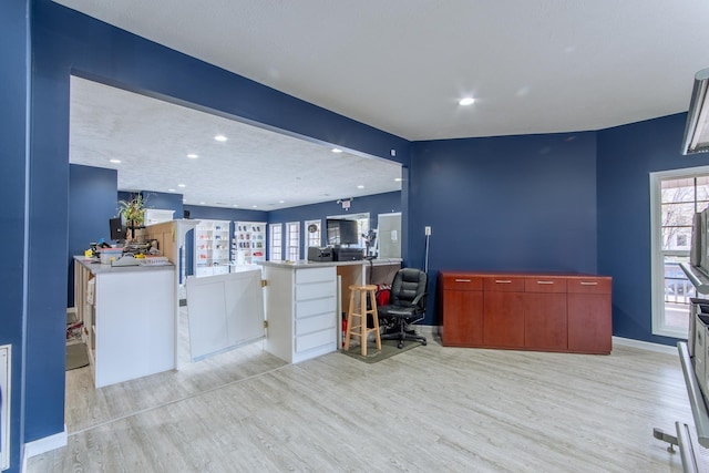 119 N 4th St, Selmer, TN 38375 - home office featuring light wood-type flooring, plenty of natural light, and recessed lighting