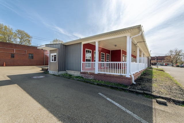 119 N 4th St, Selmer, TN 38375 - view of front of property with a porch and board and batten siding