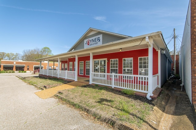 119 N 4th St, Selmer, TN 38375 - view of front of house featuring a porch