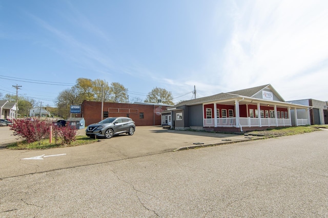 119 N 4th St, Selmer, TN 38375 - view of front of house with a porch and uncovered parking