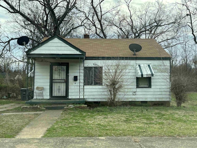 1983 Hubert Ave, Memphis, TN 38108 - view of front facade with a front yard and roof with shingles