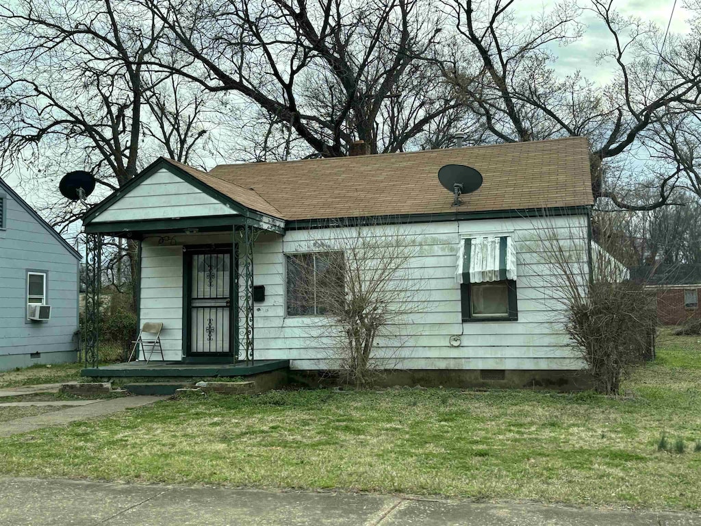 1983 Hubert Ave, Memphis, TN 38108 - view of front of house with a front lawn and cooling unit