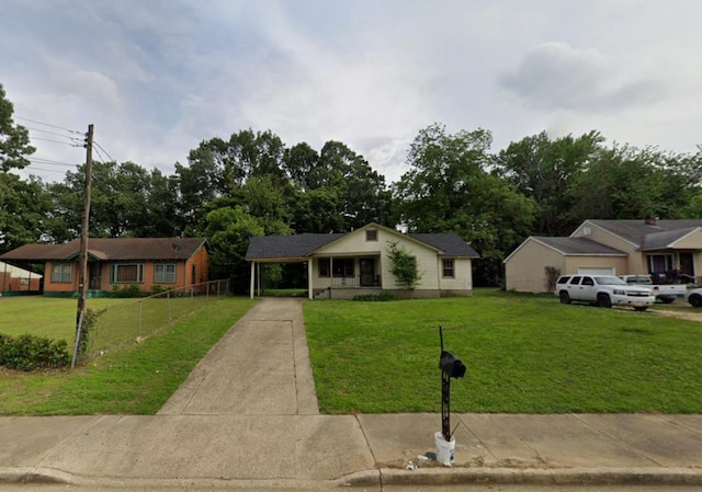 73 E Rollins Rd, Memphis, TN 38109 - ranch-style house featuring driveway and a carport