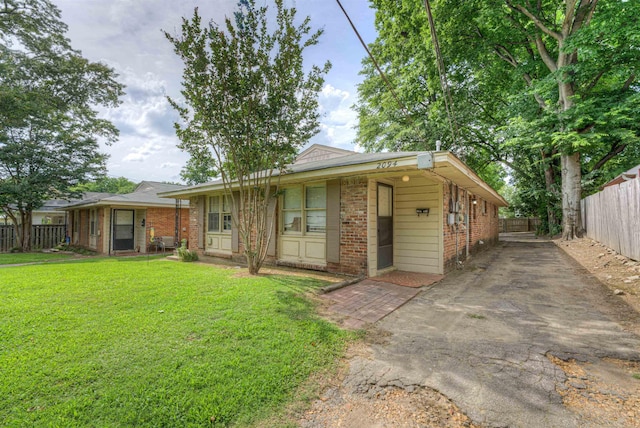 2092 Harbert Ave, Memphis, TN 38104 - view of front facade with brick siding and driveway