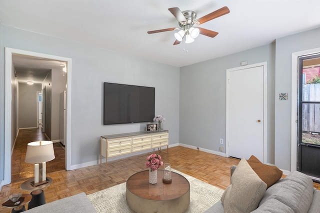 2092 Harbert Ave, Memphis, TN 38104 - living room with a ceiling fan and baseboards