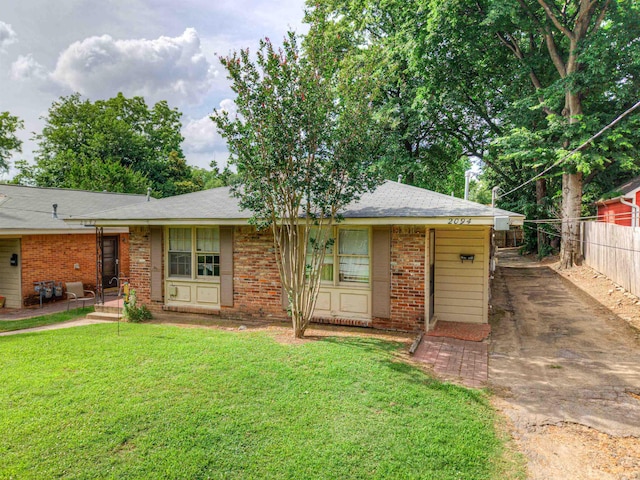 2092 Harbert Ave, Memphis, TN 38104 - view of front of house featuring brick siding and driveway