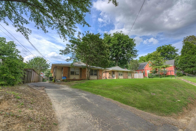2086 Harbert Ave, Memphis, TN 38104 - view of front of house featuring driveway and brick siding