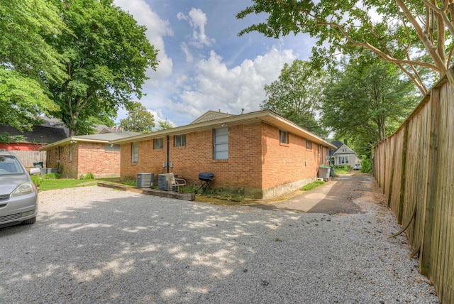 2086 Harbert Ave, Memphis, TN 38104 - view of side of home with brick siding and driveway