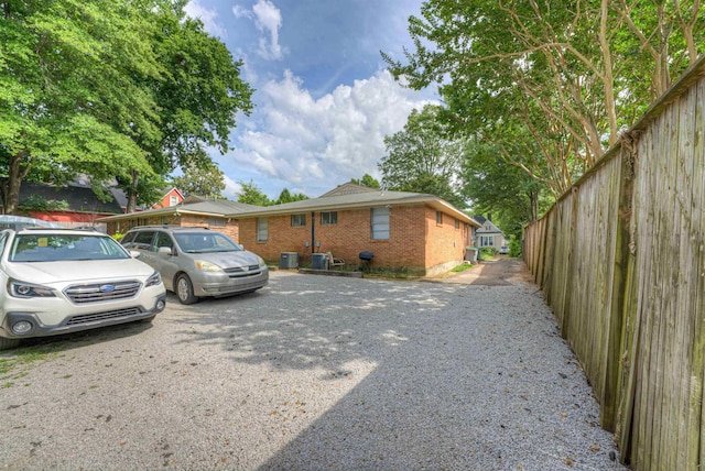 2086 Harbert Ave, Memphis, TN 38104 - view of side of property with brick siding and a central air condition unit