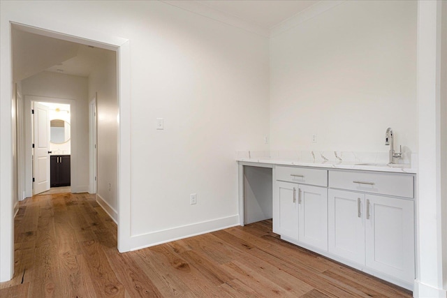 2486 E Allelon Rd E, Germantown, TN 38138 - indoor wet bar featuring light wood-type flooring and crown molding