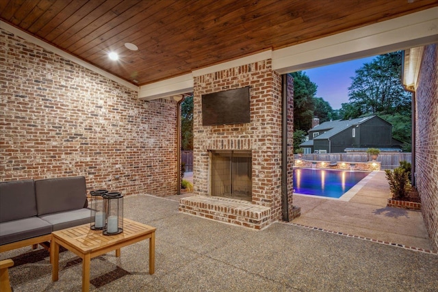 2486 E Allelon Rd E, Germantown, TN 38138 - living area featuring wood ceiling, brick wall, an outdoor brick fireplace, and carpet floors