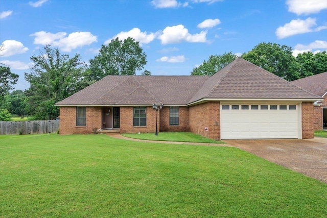 3889 Oak Trace Cv, Bartlett, TN 38135 - single story home with a garage, driveway, brick siding, and a shingled roof