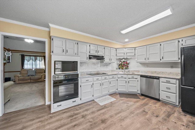3889 Oak Trace Cv, Bartlett, TN 38135 - kitchen with black appliances, under cabinet range hood, ornamental molding, a textured ceiling, and light wood-style floors
