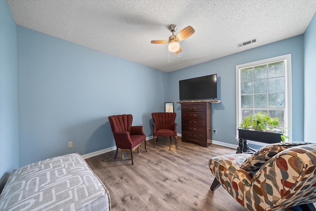 3889 Oak Trace Cv, Bartlett, TN 38135 - sitting room featuring a ceiling fan, wood finished floors, and a textured ceiling