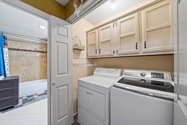 3889 Oak Trace Cv, Bartlett, TN 38135 - washroom featuring cabinet space, washing machine and dryer, and a textured ceiling