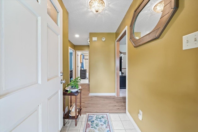 3889 Oak Trace Cv, Bartlett, TN 38135 - entrance foyer featuring light tile patterned floors and a textured ceiling