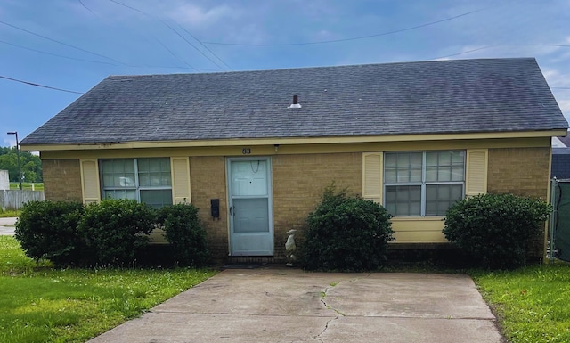 83 Henry St, Marion, AR 72364 - view of front of house featuring brick siding and a shingled roof