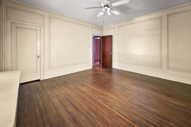 2067 Hallwood Dr, Memphis, TN 38107 - empty room with a decorative wall, wood finished floors, and ceiling fan