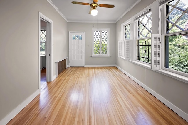 2067 Hallwood Dr, Memphis, TN 38107 - empty room with light wood finished floors, ornamental molding, and ceiling fan