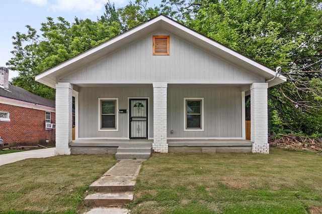 2343 Zanone Ave, Memphis, TN 38114 - bungalow with covered porch and a front lawn